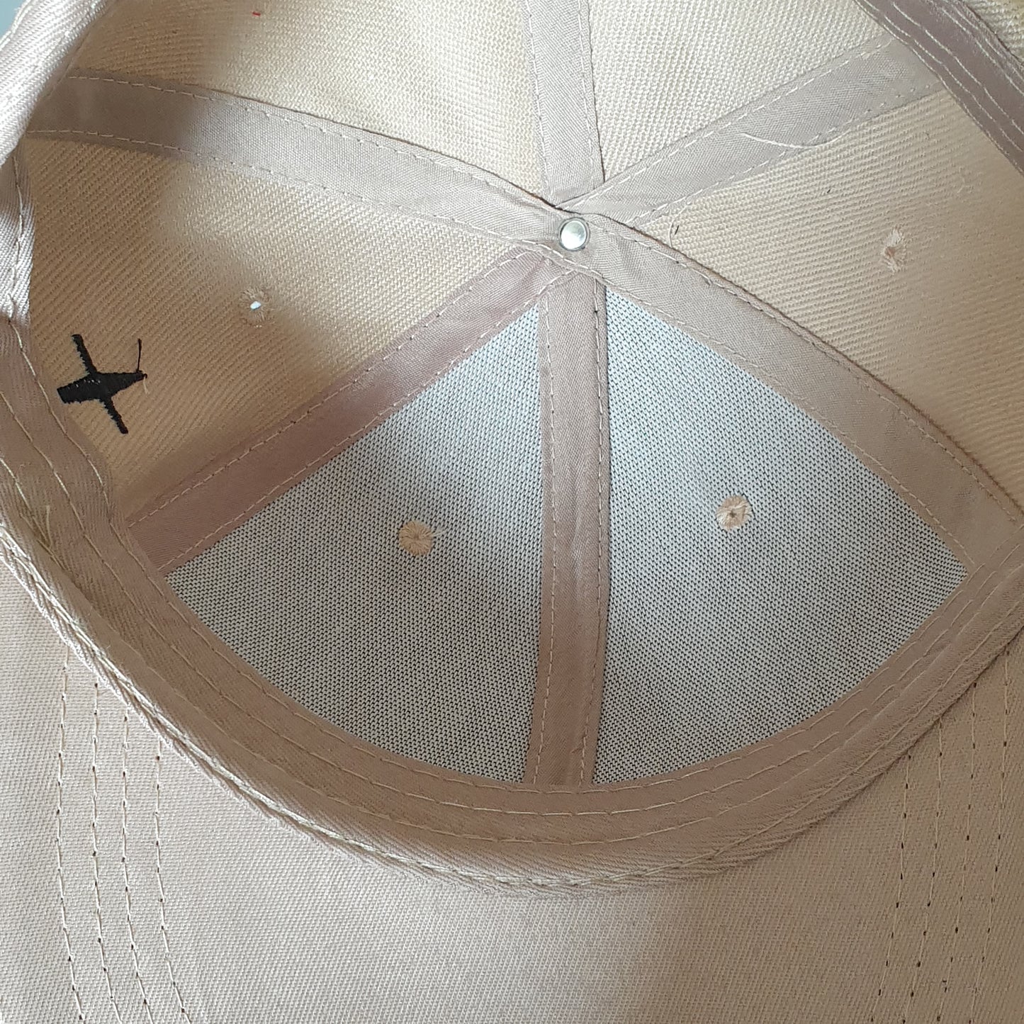 Adjustable beige cap cross drop