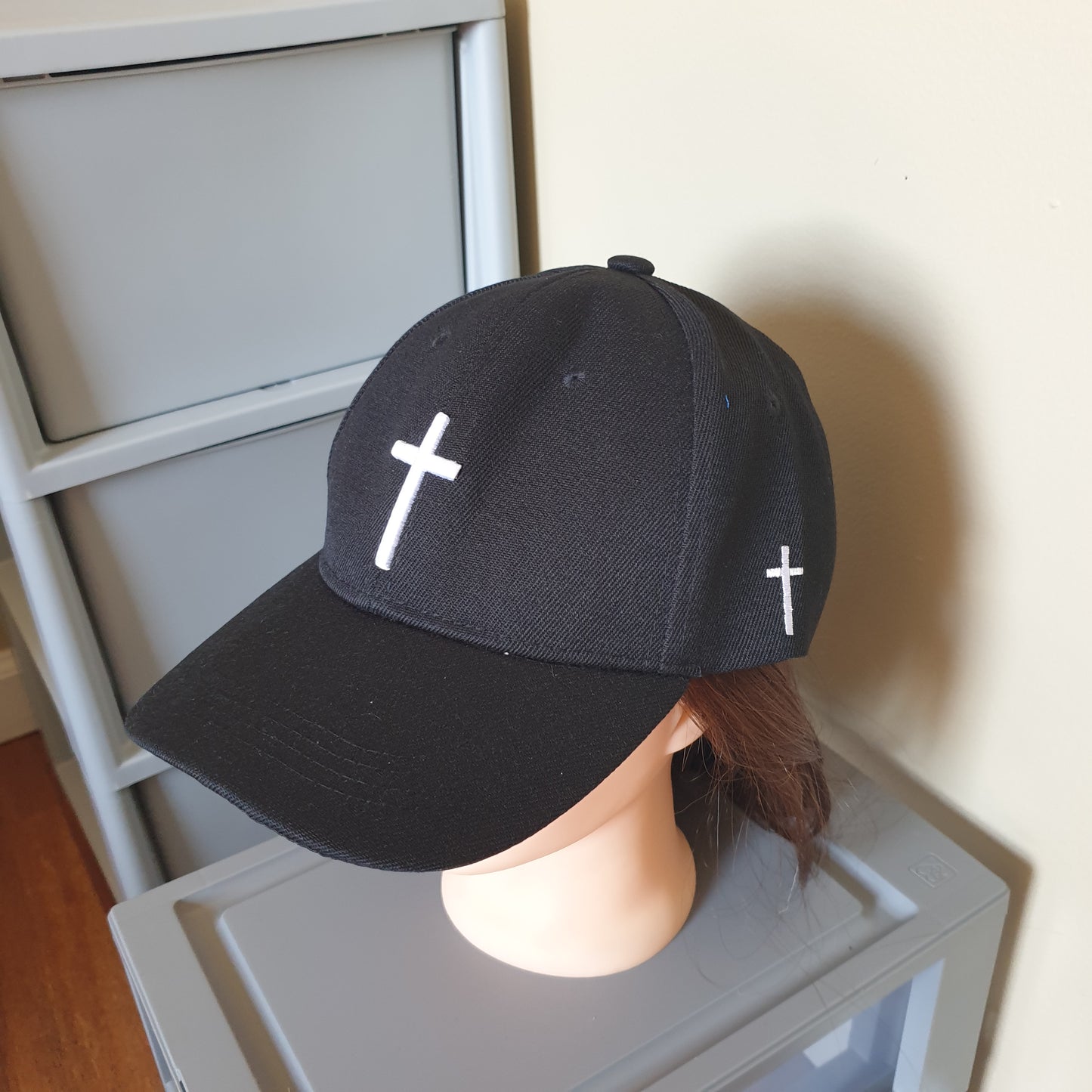 Adjustable black cap cross