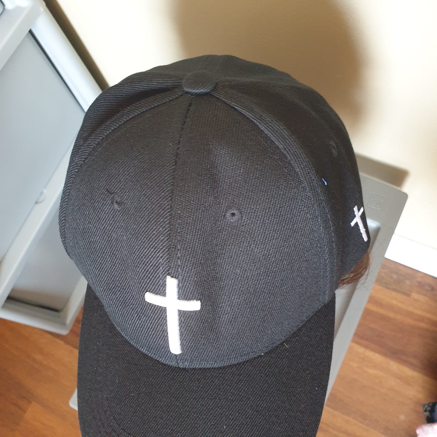 Adjustable black cap cross