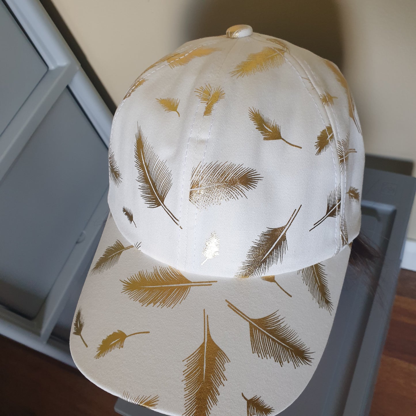 Adjustable white cap feather